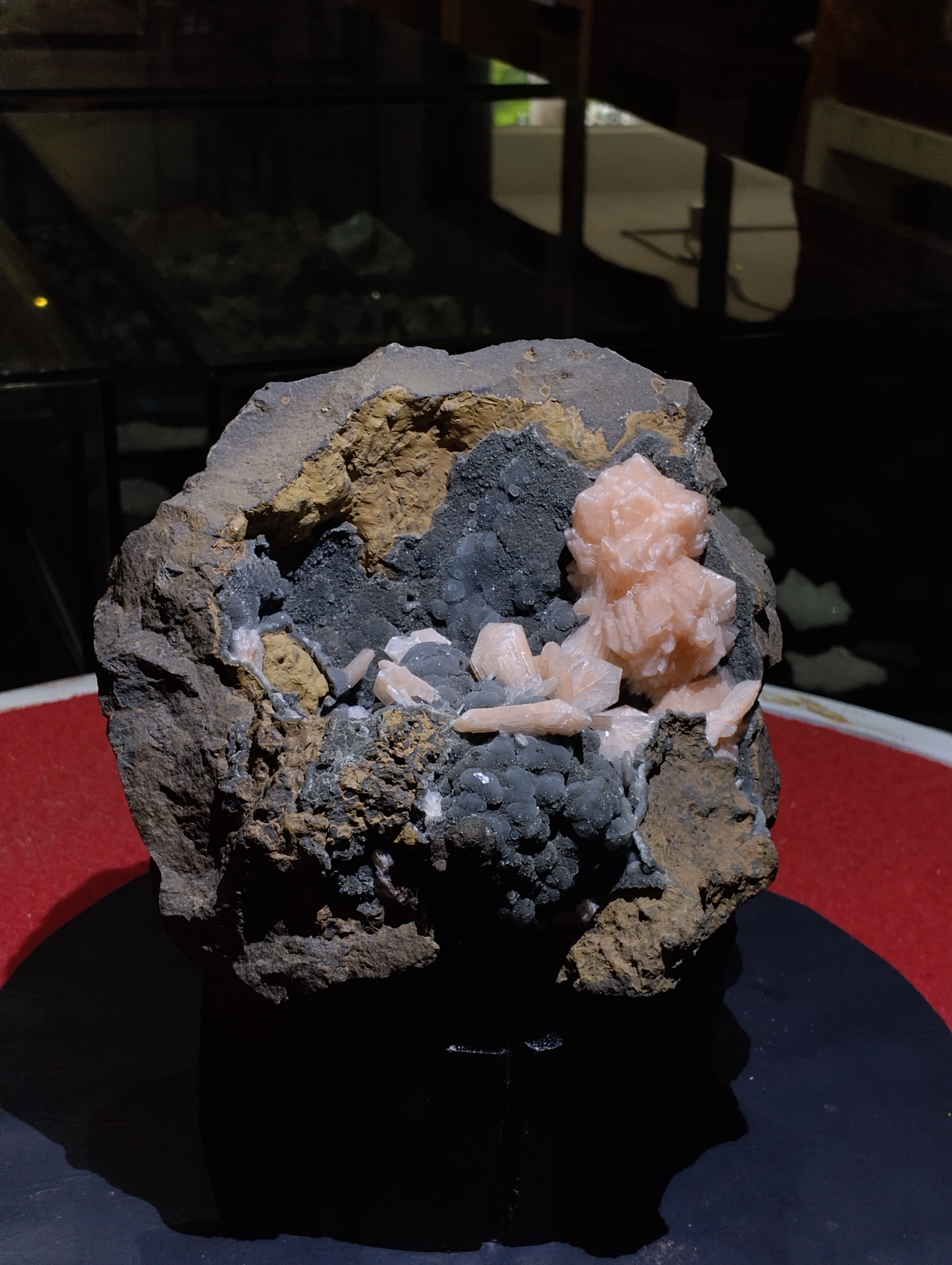 Natural Stilbite with Chalcedony on Basalt Matrix
✨ A striking mineral masterpiece, this specimen beautifully showcases the gentle elegance of peach Stilbite crystals resting against a dark Chalcedony druzy background, all set within a rugged Basalt matrix. This unique combination makes it not only a collector’s delight but also a powerful energy piece for spiritual and decorative purposes.
Appearance &amp; Structure
The stone presents a rough natural basalt base, providing a strong earthy foundation.
Clusters of soft, peach-colored Stilbite crystals bloom gracefully on the surface, their elongated, blade-like formations resembling delicate flower petals.
The background is coated with dark-grey Chalcedony druzy spheres, adding a beautiful textural and color contrast.
Together, the Stilbite and Chalcedony create a dramatic visual balance of light and dark, soft and solid, smooth and sparkling.